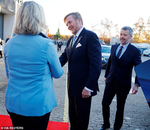 The Kings arrived wearing highly polished shoes and similar suits, both navy blue.