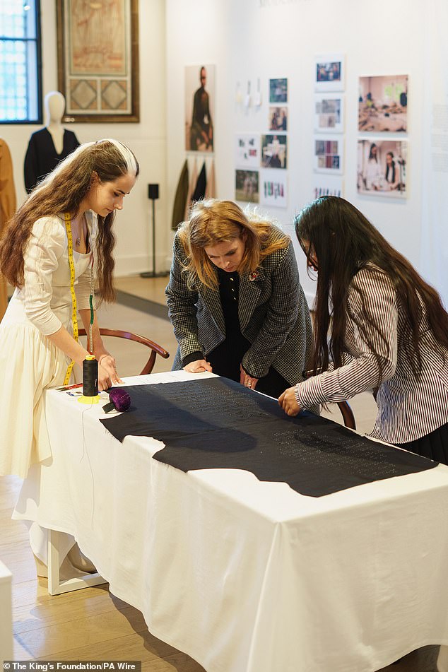 In the image: Princess Beatrice participates in a demonstration by uniformed students.