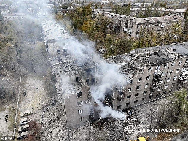 A photo provided by Ukraine's State Emergency Service shows the site of a rocket attack on a five-story residential building in Kryvyi Rih, Ukraine, on Nov. 11, 2024.