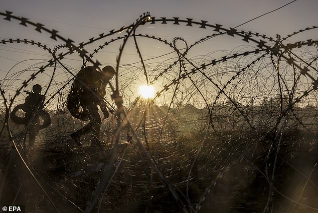 A photo provided shows Ukrainian military installing anti-tank landmines and non-explosive obstacles along the front line at an undisclosed location near Chasiv Yar, Donetsk region, eastern Ukraine, on October 30, 2024.