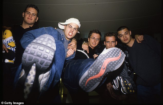 The singer (pictured, second on the right) was previously a member of the beloved boy band from its inception in 1997, until its split in 2001.