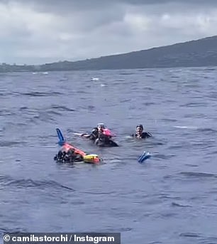 1731425475 139 Miraculous moment vomiting scuba divers are rescued by boat off