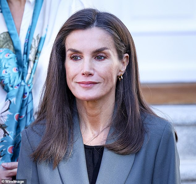 The Queen of Spain let her brown hair fall to her shoulders and kept her look simple with subtle makeup consisting of light eyeshadow and pink lip gloss.