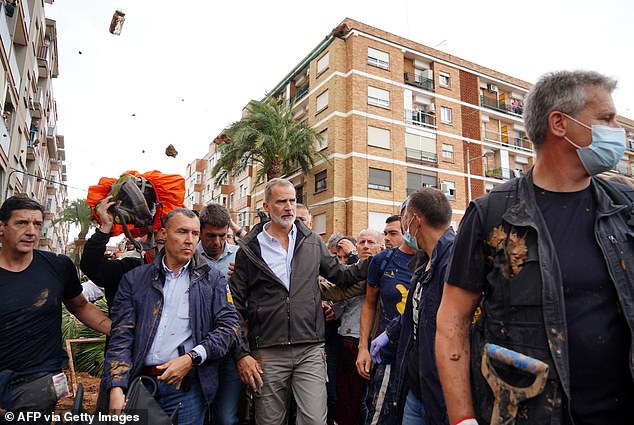 King Philip of Spain is booed and thrown mud by an angry local during a visit to Paiporta in Valencia, where more than 200 people died in devastating floods.