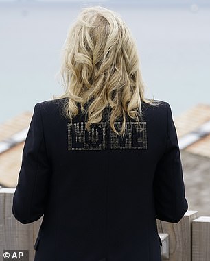 Jill Biden turns to show the floor "love" on the back of your jacket in 2021