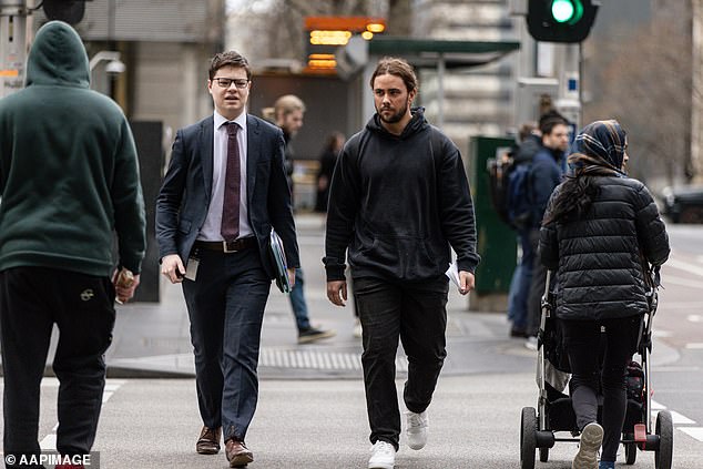 Pledger (right) photographed arriving for sentencing during a court appearance in August