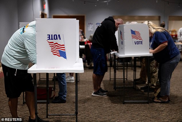 His incendiary comments left the city (pictured heading to the polls) on edge, with locals warning that bullets would fly due to tensions stoked by anti-immigrant rhetoric sweeping social media.