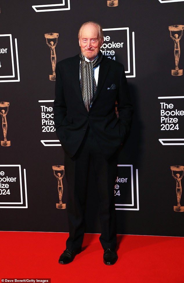 Actor Charles, 78, looked dapper in a black suit worn with a printed scarf when he arrived.