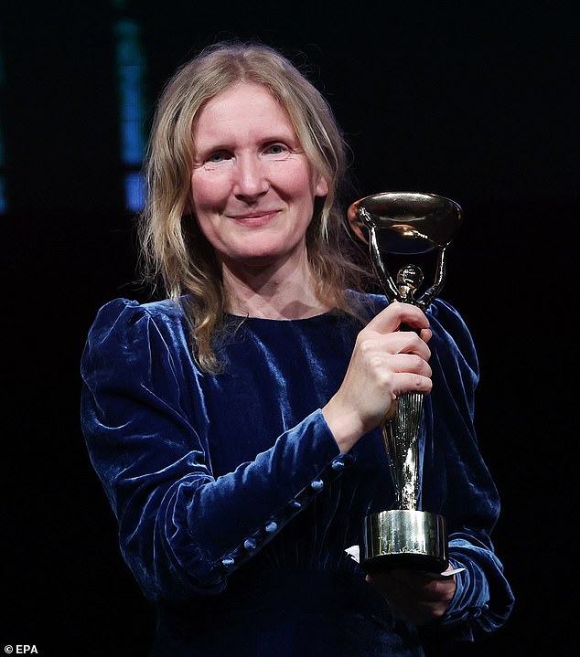 He posed with his award at the awards ceremony in London