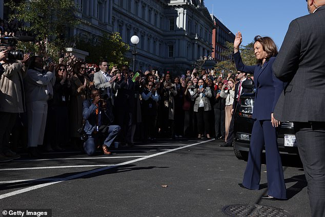 Vice President Kamala Harris greets attendees who greeted her return to the White House complex from the steps of the Eisenhower Executive Office Building on Tuesday.