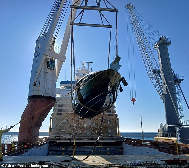 The newly arrived ship's luxurious blue and white boat is seen being carefully hoisted so that Portelli can enjoy his new luxury purchase.