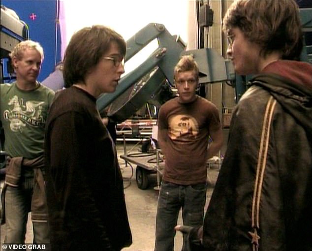 Holmes told his story in the documentary The Boy Who Lived and spoke fondly of his current friendship with Hollywood star Daniel. Pictured: Radcliffe (right) and Holmes (second from left) during the filming of Harry Potter and the Goblet of Fire.