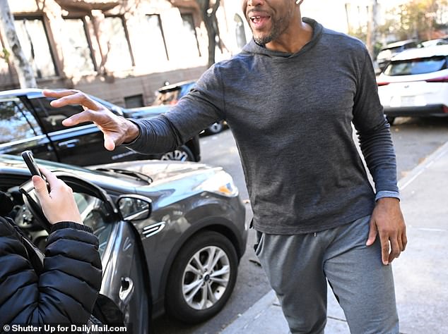 The former New York Giants star took the journalist's phone and threw it into a nearby bush.