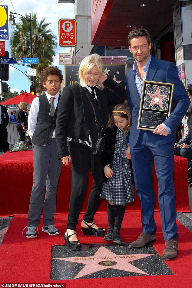 Force of nature: The Dry 2 actress and Jackman's two adopted children are legal adults, but they will have a hard time splitting his alleged $180 million fortune (pictured in 2012).