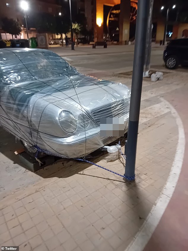 They also tied their cars to streetlights, after the scenes of mass destruction in Valencia