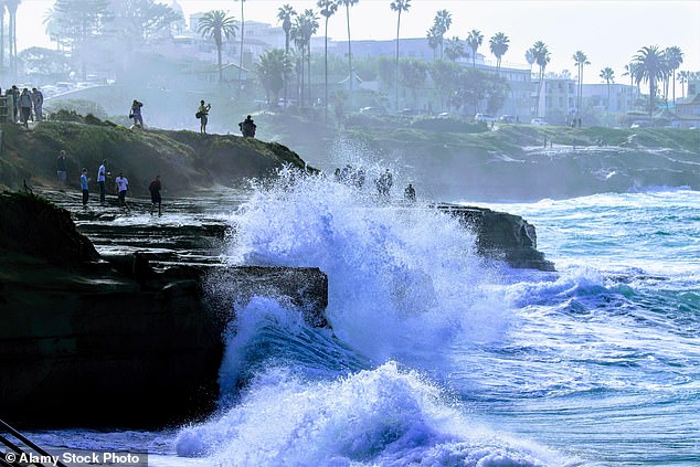 Even the most experienced swimmers have been warned to stay out of the water because large waves can create a strong undercurrent that will sweep people into the sea (stock)