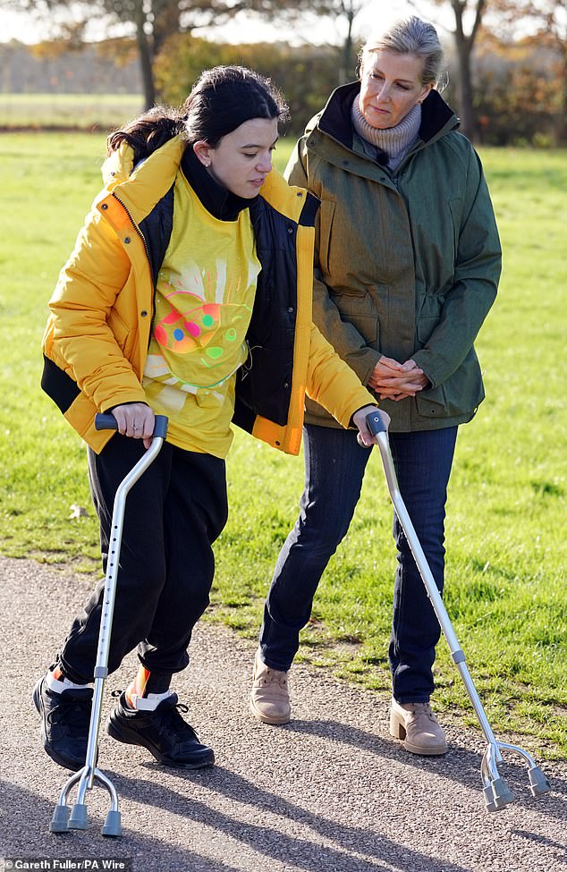 Mum-of-two Sophie (pictured right), dressed casually in skinny jeans and a turtleneck, bundling up in a winter jacket while out on the Long Walk today.