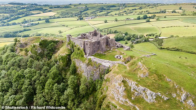 Carreg Cennen Castle (pictured above) 'overlooking miles of pristine countryside from its own summit'