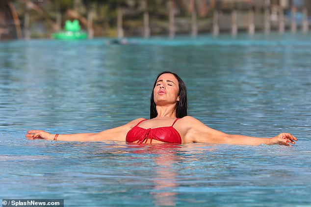 Chantelle floated in the pool.