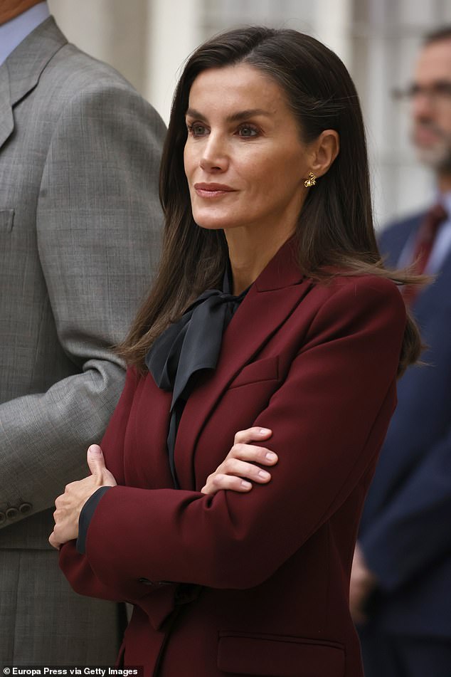 Letizia looked typically chic as she wore her brunette hair down in a sleek, blow-dried style.