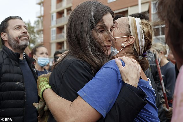 Queen Letizia hugs a woman affected by the floods of November 3