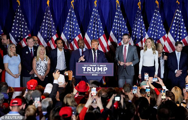 Leavitt (far left) on stage with key members of the Trump world on New Hampshire primary night in Nashua, including Rep. Marjorie Taylor Greene, Eric and Lara Trump, Sen. Tim Scott and former presidential candidate Vivek Ramaswamy.