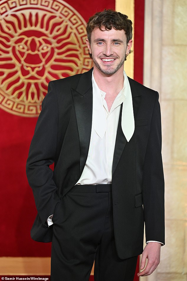 Paul, who plays former heir to the Roman Empire Lucius Verus in the blockbuster, opted for a sleek black suit with a cream satin shirt.