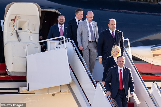 Elon Musk seen getting off the plane with members of Trump's team