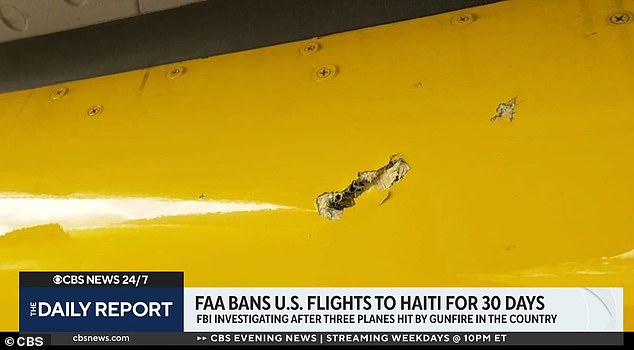 Bullets fired at a Spirit Airlines plane caused the flight to divert, injuring a flight attendant