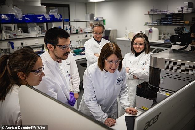 Chancellor Rachel Reeves looks at a computer analyzing cell sorting experiments during a visit to Quell Therapeutics' new offices in London.