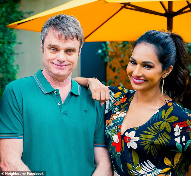 Damien Richardson (left) is pictured with his Neighbors co-star Sharon Johal (right) on the set of the soap.