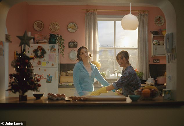 In one particularly touching scene (pictured), Sally meets her late mother and shares a brief festive moment with her.