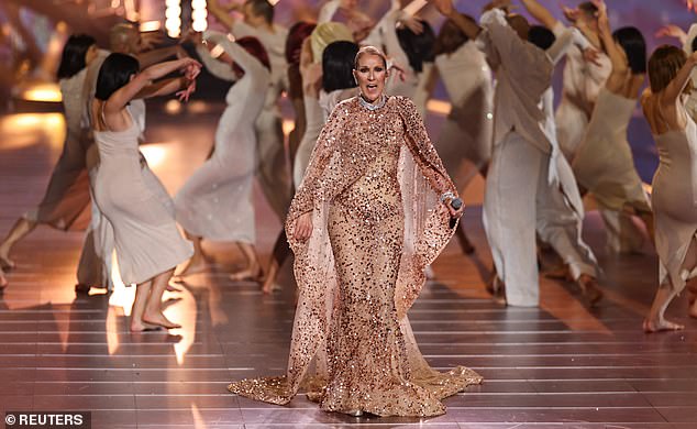 1731547059 109 Celine Dion dazzles in a shimmering pink gown as she