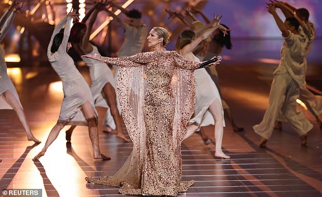 1731547061 905 Celine Dion dazzles in a shimmering pink gown as she