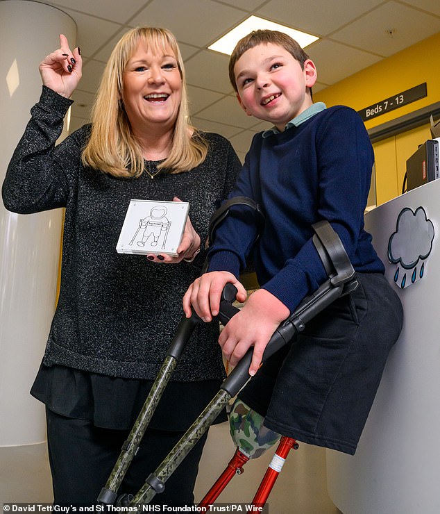 Tony was adopted by Paula and Mark Hudgell after suffering abuse at the hands of his biological parents. Tony and Paula are pictured in March.