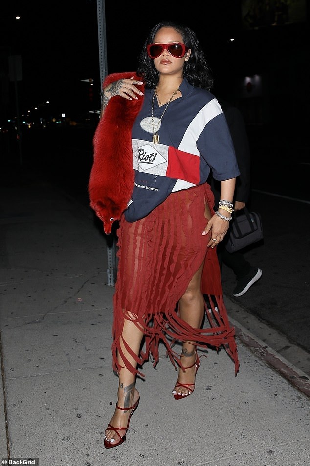 She paired her bold skirt with a navy nautical Martine Rose tee that had 'Riot!' written on the front, which turns out to be the name of his eldest son?