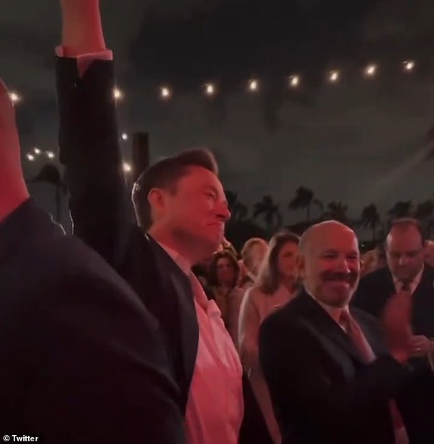 The pair appeared in several videos posted to social media throughout the night, including one in which Musk quickly, awkwardly, raised his hand after someone asked: 