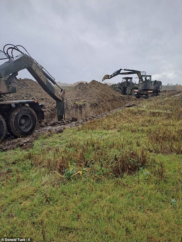 Poland's Prime Minister Donald Tusk shared the image above with the caption: 'Construction of the Eastern Shield has begun! First works on the border with Russia'