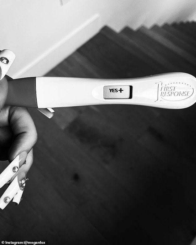 A black and white photo showed the beauty, who shares three children with her ex-husband Brian Austin Green, holding a positive pregnancy test.