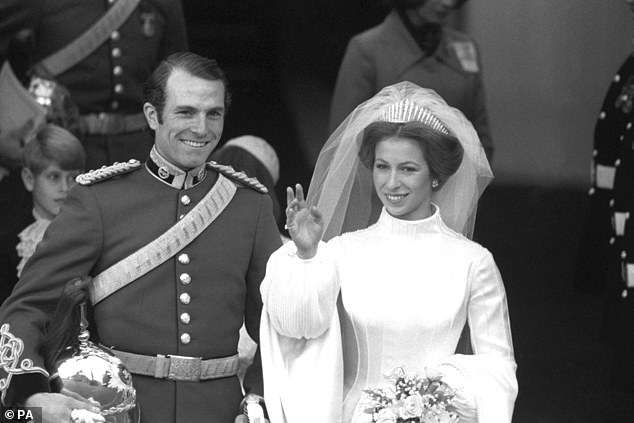 Anne pulled her hair into an elegant bun and secured her veil in place with the fringed Queen Mary tiara, now the most worn accessory for Windsor brides.