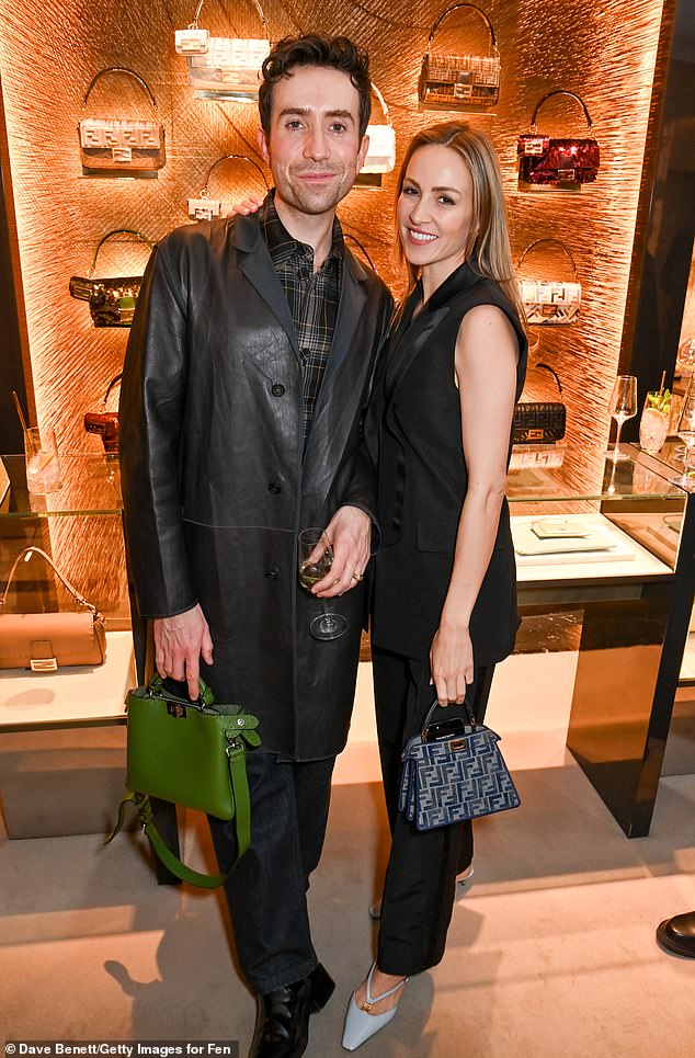 Nick Grimshaw looked dapper in a leather trench coat as he joined Carmen Jorda