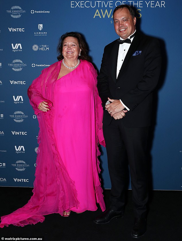 The 70-year-old mining magnate was all smiles as she posed on the black carpet in a fuchsia dress at The Star Sydney.