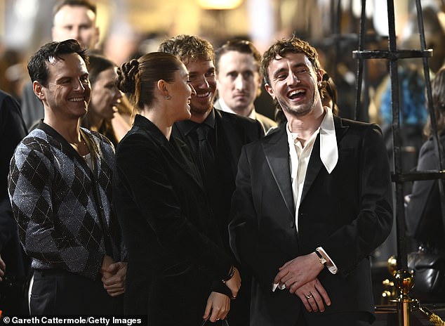 Paul and Andrew were seen smiling as they chatted before heading to the red carpet to take photos together.