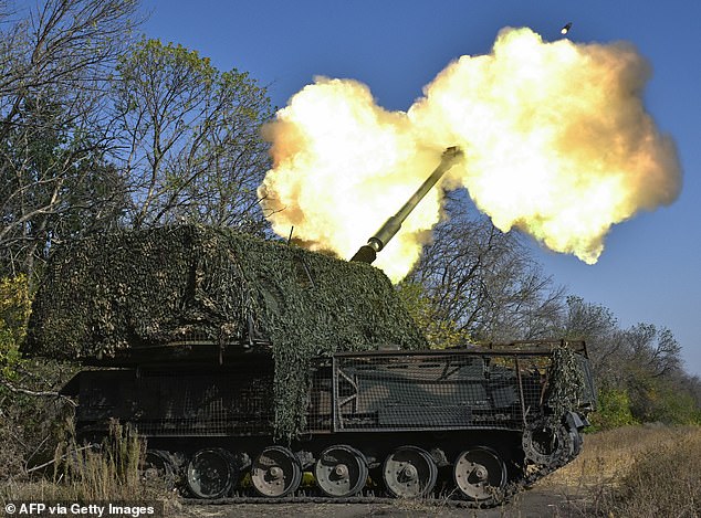 Ukrainian servicemen of the 26th artillery brigade fire an AHS Krab self-propelled howitzer towards Russian positions near the front line in the Chasiv Yar area