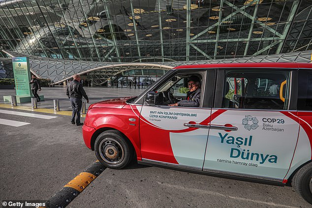 An electric taxi parked outside a terminal at Heydar Aliyev International Airport ahead of the United Nations Climate Change Conference COP29 on November 3.