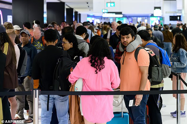 Flights to and from Bali were thrown into chaos earlier this week due to ash clouds from Mount Lewotobi Laki-Laki. Pictured are passengers at Sydney International Airport.