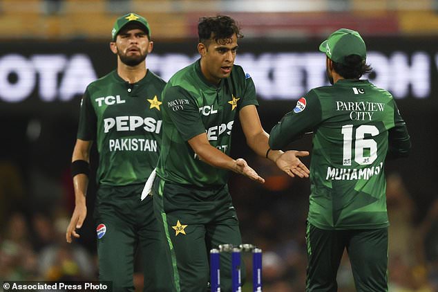 Pakistan's Abbas Afridi celebrates with teammate Mohammad Rizwan, right, after dismissing Australia's Glenn Maxwell during the T20 international cricket match between Pakistan and Australia at the Gabba in Brisbane, Australia, Thursday, November 14, 2024 (AP Photo/Tertius Pickard)