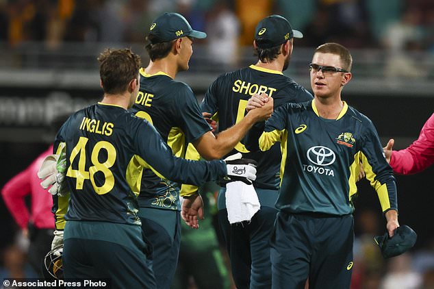 Australia's Adam Zampa, right, celebrates with his teammates after defeating Pakistan during the T20 international cricket match between Pakistan and Australia at the Gabba in Brisbane, Australia, Thursday, Nov. 14, 2024. (Photo AP/Tertius Pickard)