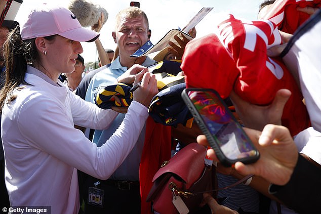 Clark was mobbed all over the field, with fans desperate to get their hands on her signature.