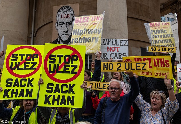 Protesters opposing the extension of London's ultra-low emissions zone demonstrate outside BBC Broadcasting House on July 22, 2023, in London.